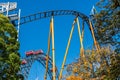 A rollercoaster and the world famous Weiner Riesenrad giant Ferris wheel of Prater Park in Vienna. Prater Park is home to Royalty Free Stock Photo